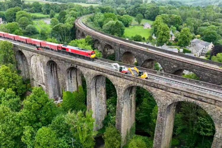 A freight train passes over Chapel Milton viaduct