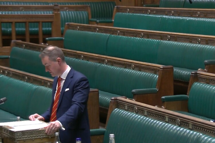Construction minister Chris McDonald addresses a virtually empty chamber [Images from Parliament TV]