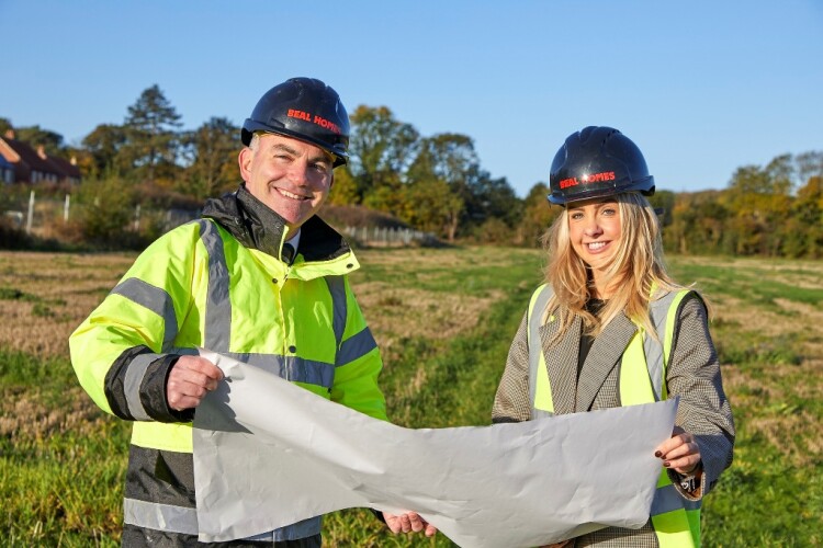 Beal Homes sales and marketing director Ross Clarkson and field sales manager Harriet Walker with plans for the extension of Pilgrims Walk